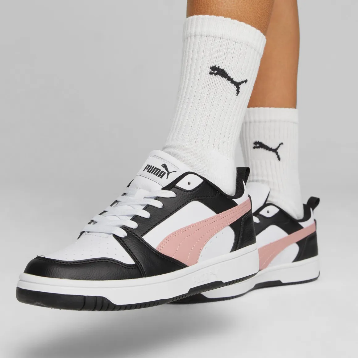 Sneakers bianche da donna con striscia laterale rosa Puma Rebound v6