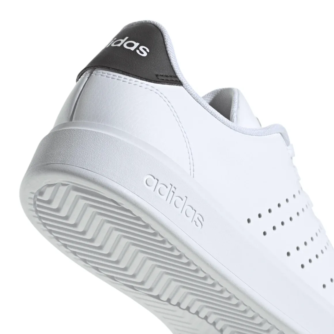 Sneakers bianche Unisex con dettagli logo traforati laterali adidas