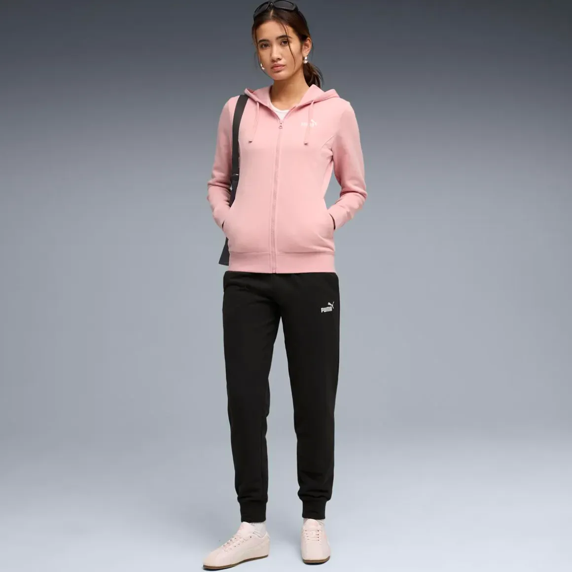 Tuta da donna rosa e nera Puma con felpa con cappuccio e zip